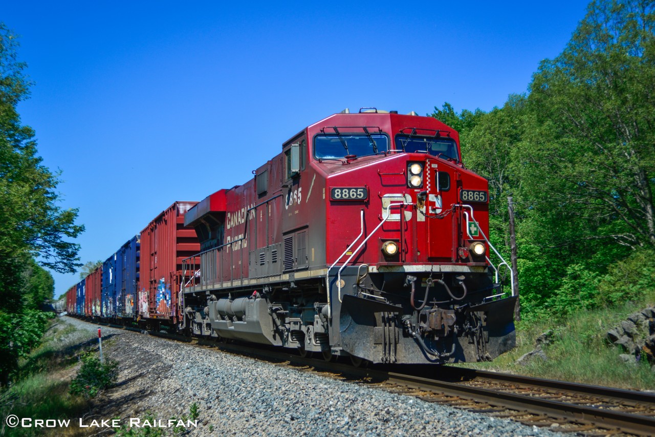 CP 118 powers through Crow Lake with pair of GE's for power.
------
I headed to Crow lake as soon as I got word that there was an eastbound coming. Within minutes I heard the horn at Crow Lake and changed a few setting on my camera to get the shot.