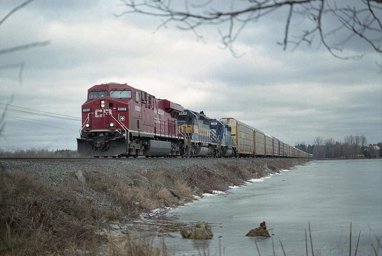 It appears from the days not very long ago when CP ran quite a few trains, the train running under the symbol #147 is one of the few still in operation, and even it is no longer a daily. The unit to "watch for" at the time of this image was the leader, CP 8888, if only for the 'neat' number. I guess we were all getting to take the leased power and others for granted. This day CP 8888, ICE 6431 and CEFX 3168 power the westbound over the causeway at the Mountsberg Conservation Area, a few miles out of Guelph Jct.
