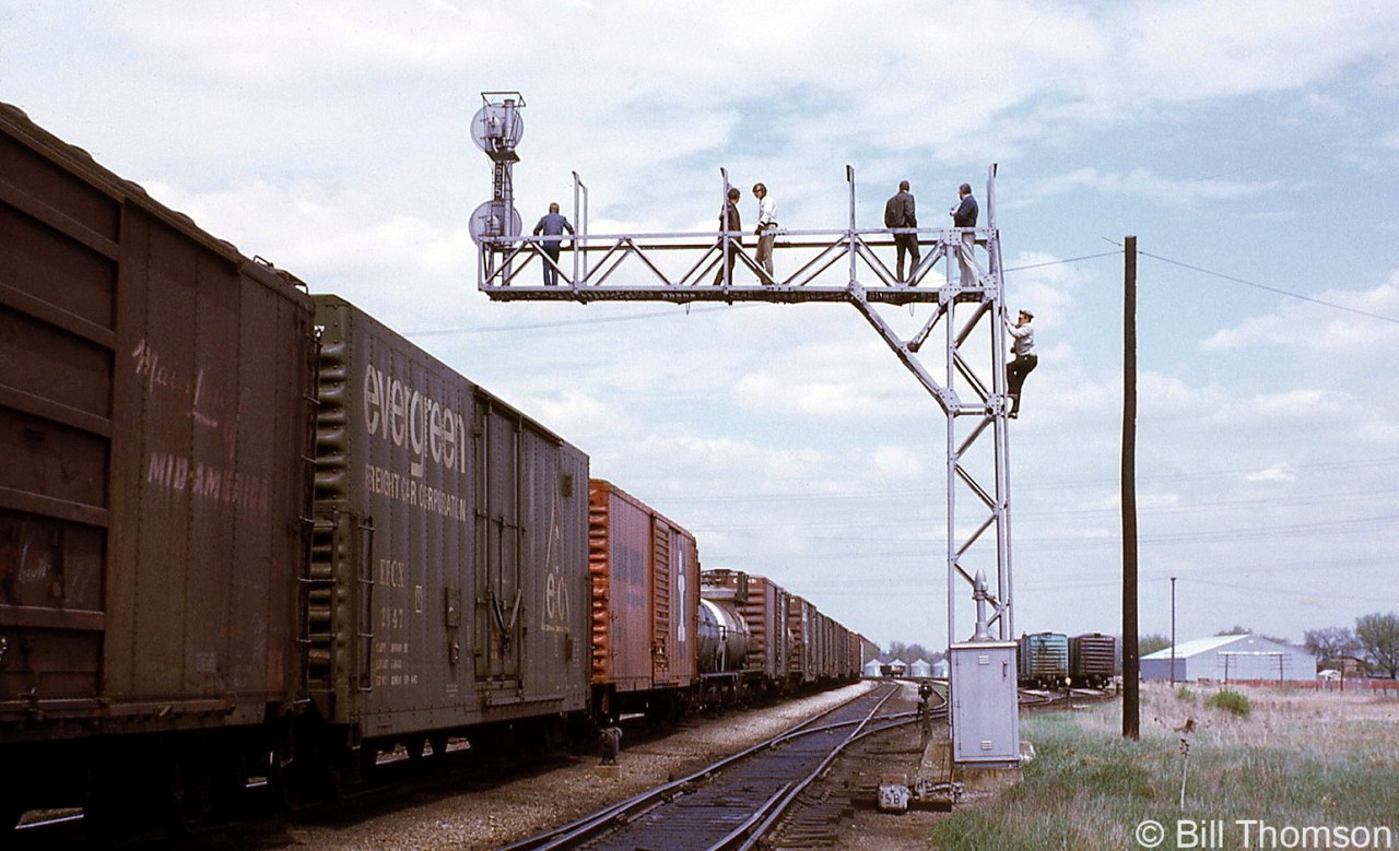In May 1970, the NMRA Niagara Division had their convention in Chatham Ontario. Some attendees took the opportunity to photograph an eastbound CP freight from the vantage point of one of the signals on the line - a railfan practice that some often did back in the day, but that would be very much frowned upon in present times.

Foreign-road boxcars mixed in the CP train include those for Illinois Central (both in modern orange, and older "Mainline of Mid-America" liveries) and the Evergreen Freight Car Corporation.