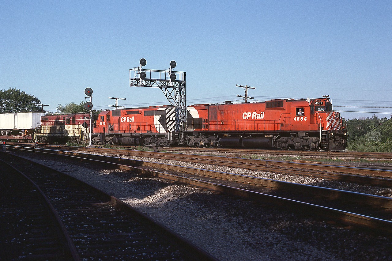 It seems that without fail the ol' "Starlite" impressed us fans.  You just never knew what you would see for power, and whatever it was, it was interesting.
Some beautiful late afternoon lighting on this delightful Wednesday evening as the train rolled thru destined for Hamilton's Aberdeen Yard on the short run from Toronto.  Power is CP 4564, 5545 and TH&B 74. The big M-630 on the lead would be retired in the early 90s, come back for a final hurrah, and be retired for good by 1995.