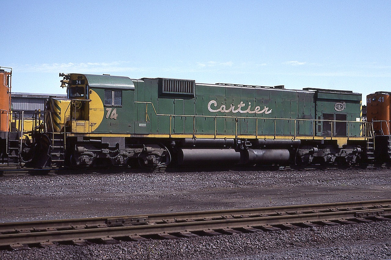 Here is an image of one of the MLW M-636 locomotives that was acquired new by the Cartier Railway in the early 1970s. An odd duck in the fact it is still wearing its' original green with yellow paint scheme. It did manage to hang on long enough to be painted to the standard black and orange of the day though. This unit was sold off to Marine Diesel Engines Ltd in 2002, as the company dispensed with all its old MLW/ALCO products and went to EMD/GE. The mining company now calls itself Arcelor Mittal Mines.
