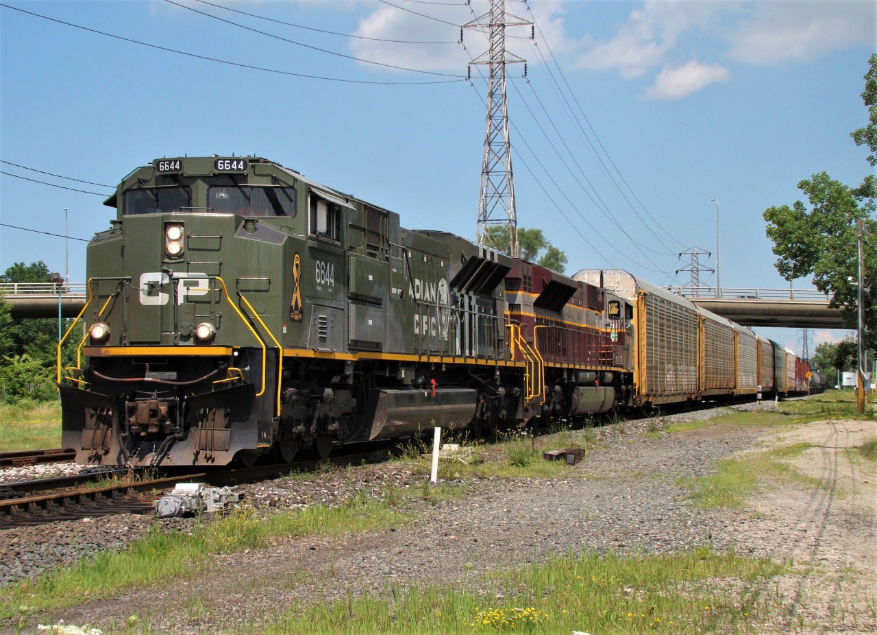 CP 6644 along with Heritage unit 7016 lead train 141 westbound through Windsor.