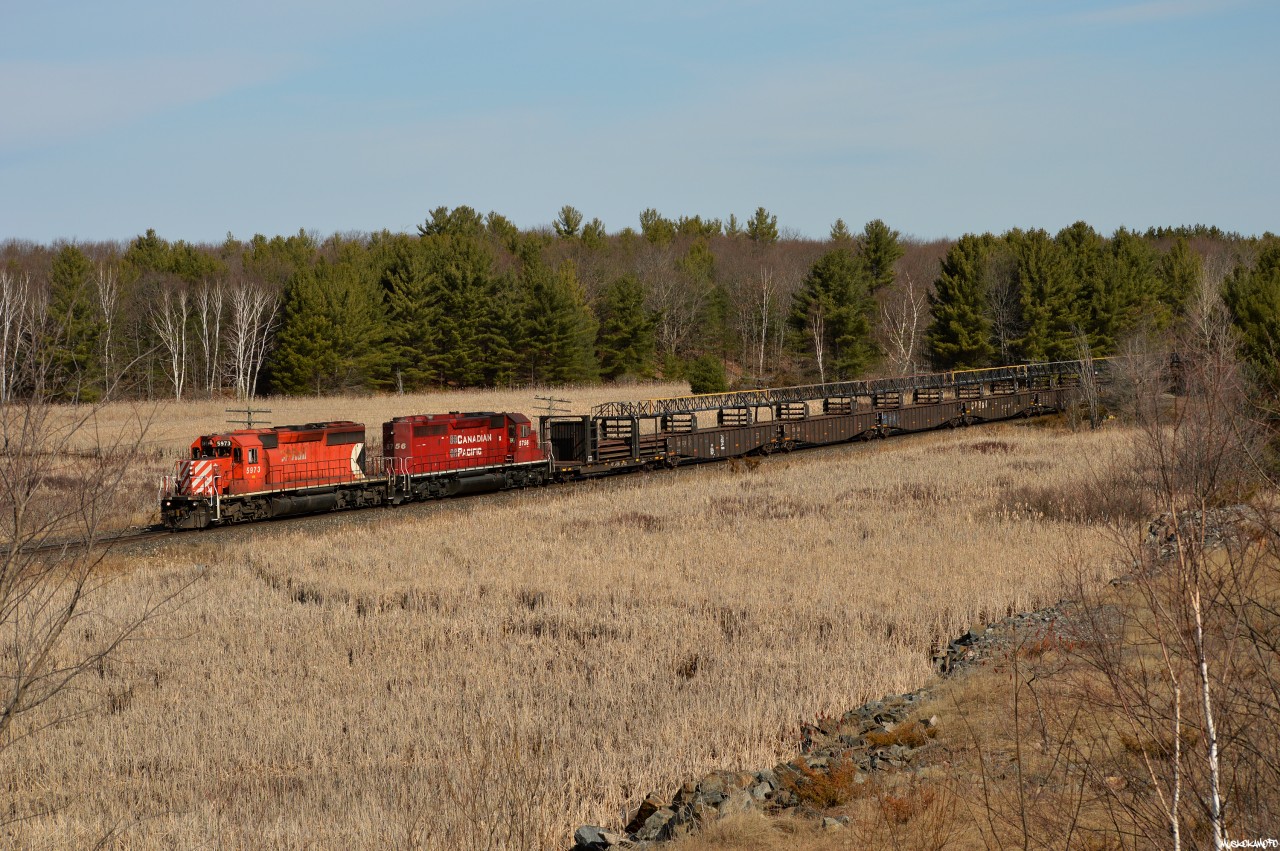 CP 5973 South with CWR-06 passing through North Parry, a former siding on CN's Bala sub torn up a few years ago despite being one of the more frequently used sidings in the DRZ between Parry Sound and Sudbury. North Parry also had the last active "Spring Switch" in Ontario, which was located a couple thousand feet North of here beyond the right side of frame.