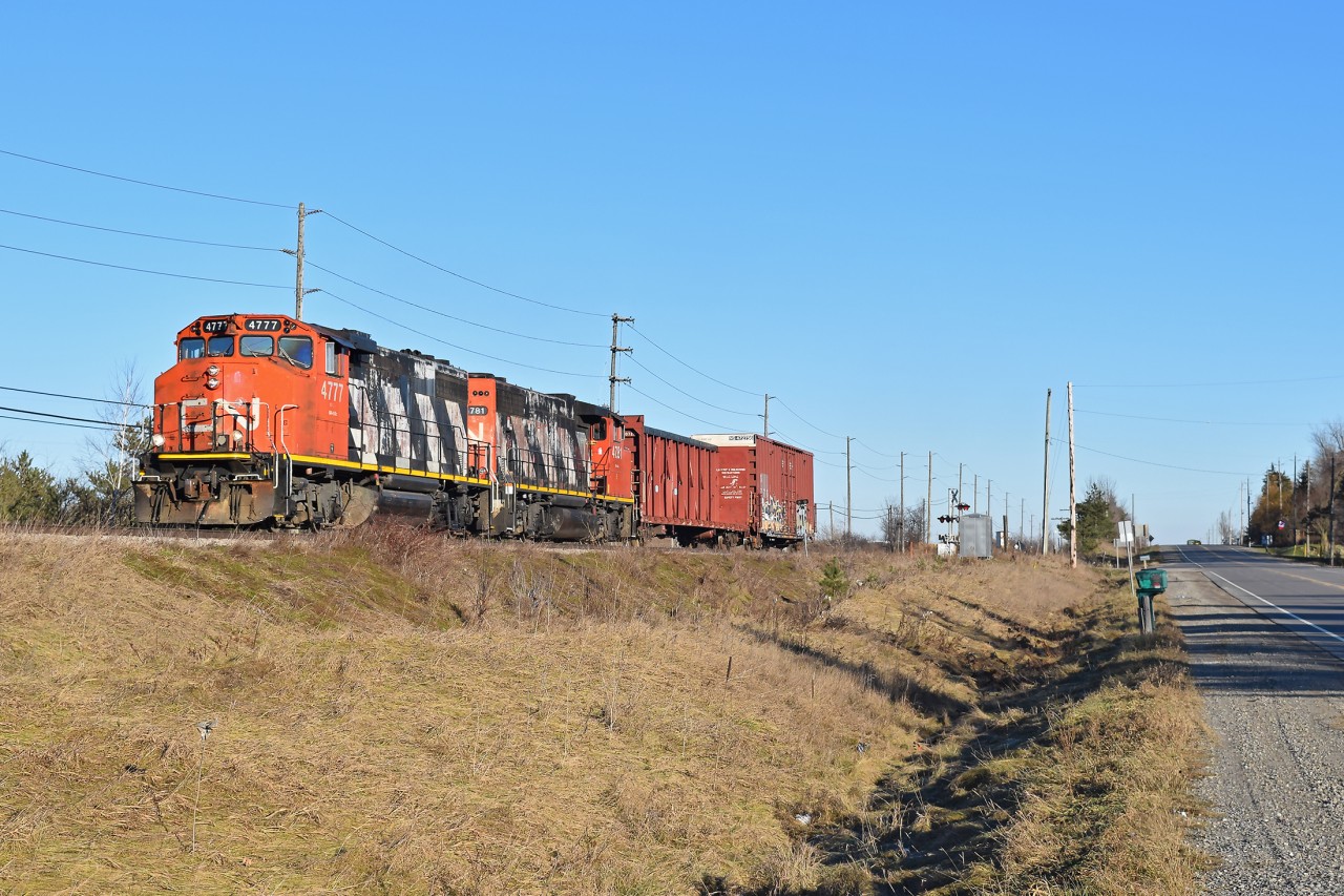 CN 4777 leads a short train west, back toward Guelph after switching Canwell in Acton. Sadly it appears fencing was just recently put up along the tracks paralleling highway 7, blocking shots like these.