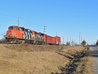 CN 4777 leads a short train west, back toward Guelph after switching Canwell in Acton. Sadly it appears fencing was just recently put up along the tracks paralleling highway 7, blocking shots like these.  