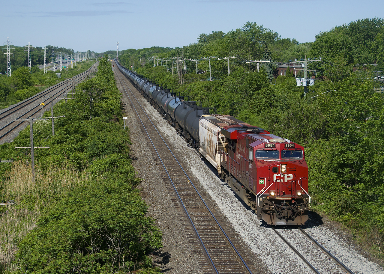 CP 8954 leads ethanol train CP 650 over a freshly ballasted section of the Vaudreuil Sub. Pushing on the rear is CP 8001.