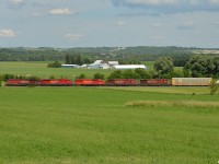 CP 421 slides through the fields just North of Alliston, 4 of today's 5 units are sporting the new beaver look, as 5th out 9615 wears one of the last remaining RCMP decals with it's original beaver. 