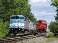 Two editions of CP 251 (formerly CMQ 1) are parked just west of Farnham. The one at left arrived on Saturday evening and has CMQ 9010 leading, the one at the right arrived early on Sunday morning and has CP 9835 leading. CP just completed its takeover of the CMQ last week.