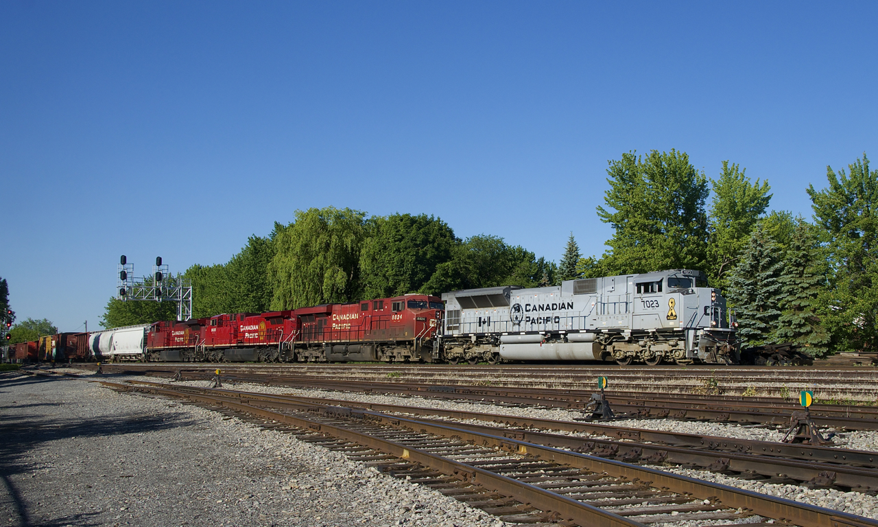 Air Force unit CP 7023 leads three GE's (CP 8824, CP 9835 & CP 8116) as CP 253 passes Lasalle Yard on a gorgeous morning.