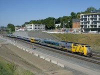 One of only four VIA Rail trains that currently run all the way between Montreal and Toronto, VIA 63 is starting to cross from the north to the south track with VIA 917 leading and VIA 918 shoving.