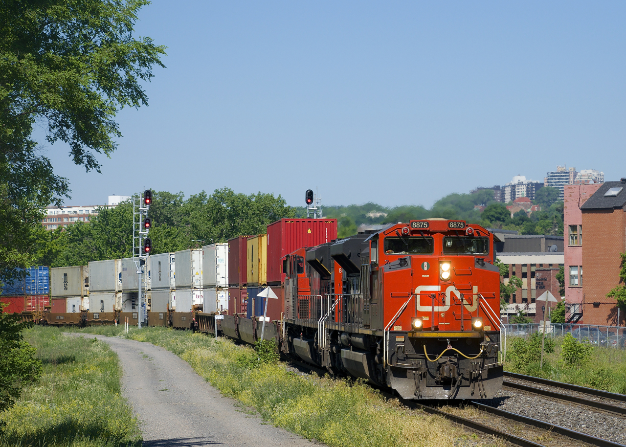 After having to hold west of St-Henri for over an hour while a signal maintainer did some emergency work at Pointe St-Charles, a very late CN 148 with a pair of SD70M-2s for power (CN 8875 & CN 8880) is on the move towards the Port of Montreal. As soon as CN 148 is done with this power, CN 149's crew (on-duty and waiting a couple hours at this point) will use this power directly from the port.