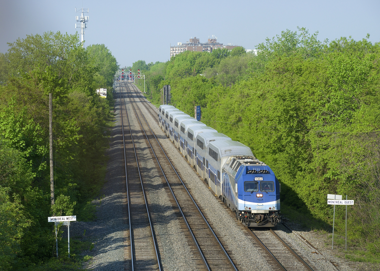 EXO 174 has AMT 1362 and nine bilevel cars as it heads east on CP's Westmount Sub.