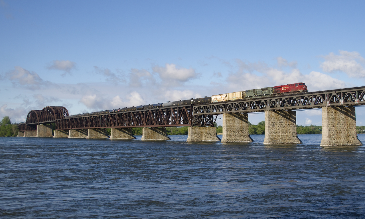 CP 651 has CP 8918 and military unit CP 7020 as it crosses the St. Lawrence River with ethanol empties from Albany.
