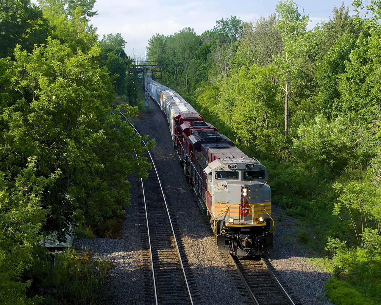 CP 253 with SD70ACU's CP 7010 and CP 7043 is passing North Jct, its voyage from Saratoga Springs nearly over.