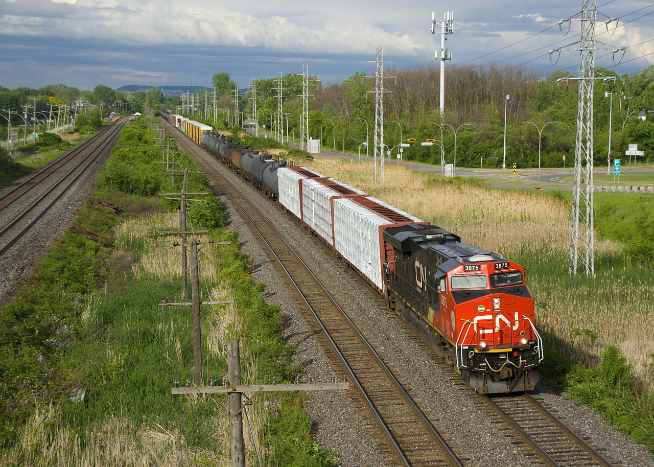 During a lucky break in the clouds a very late CN 305 is westbound past MP 14 of CN's Kingston Sub with CN 3875 up front and CN 2874 mid-train
