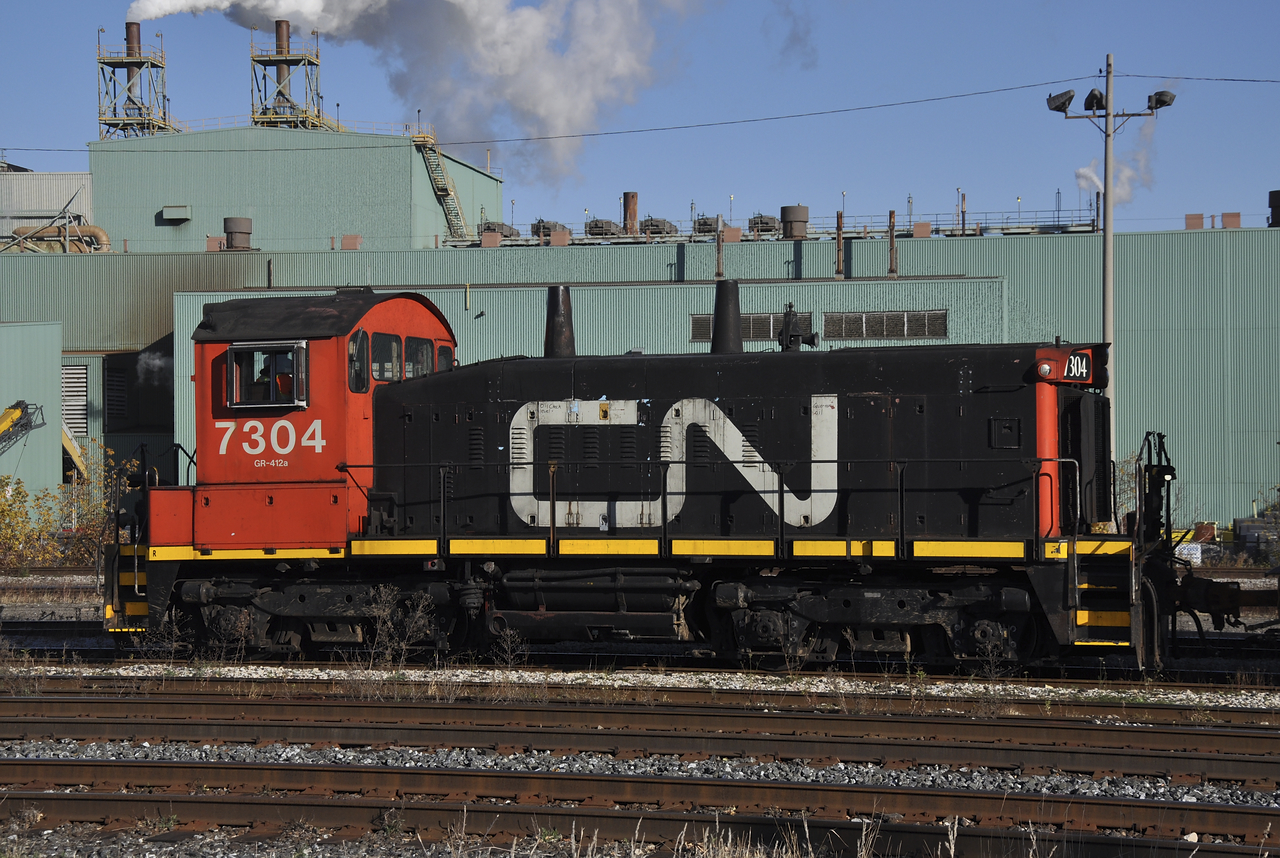 CN 7304 with another cut of coils and boxcars scurries around in Parkdale Yard. Hard to believe at some point, CN was rostering 208 SW1200RS's. Im not sure how many are still active on CN's roster. I know one is still based in MacMillian assigned to local jobs around the yard.