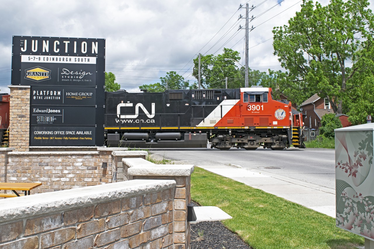 CN 533 makes a rather uncommon daylight appearance in Guelph. Passing the really well done "The Junction" building on Edinburgh Road in Guelph.
