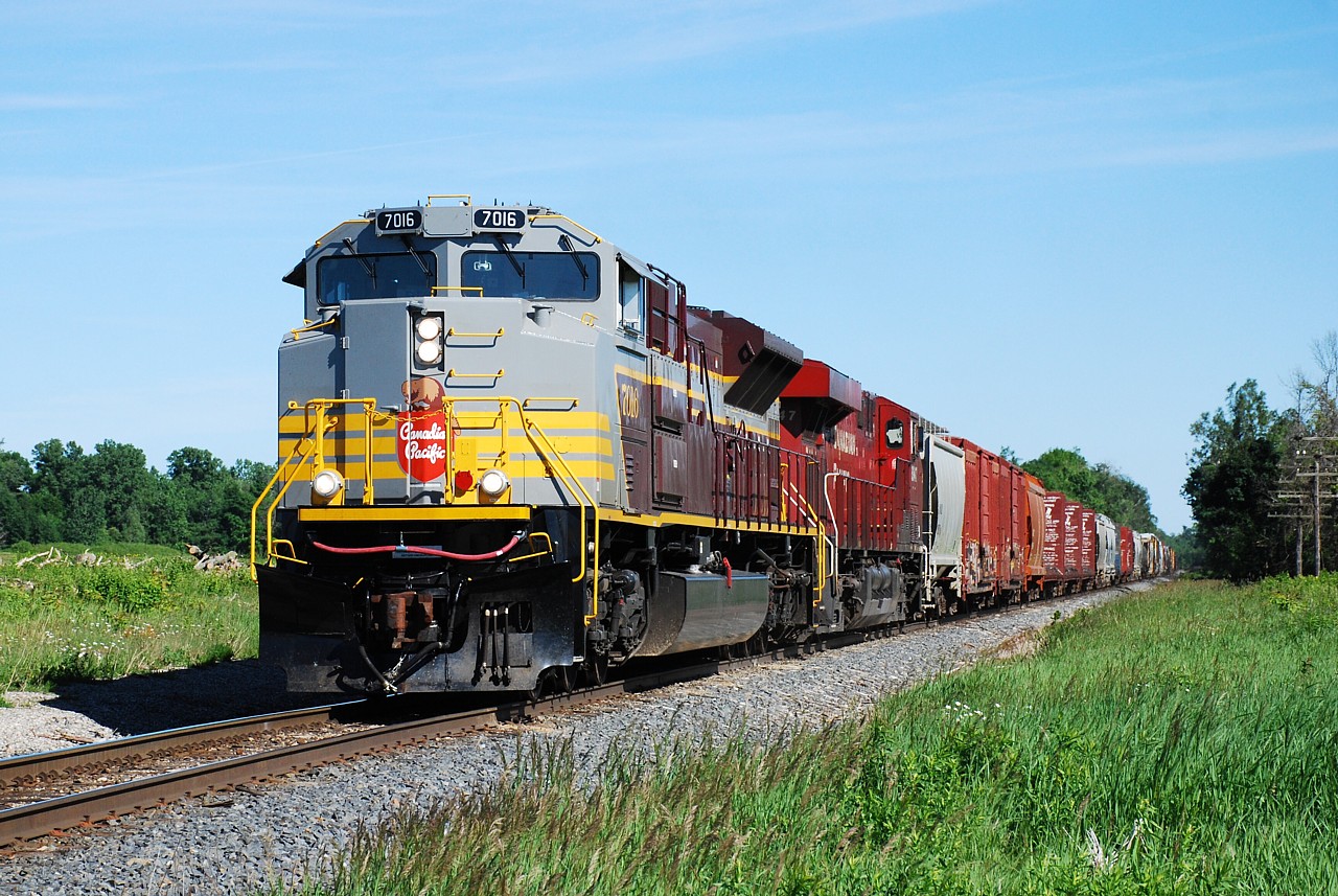 I wasn't able to get out and photograph CP 246 with 7016 leading yesterday.  Thanks to a timely phone call today I was able to run out to Concession Road 6 with a few minutes to spare and get CP 247 returning north with 7016 leading again.  Thanks for the heads-up Jazzy Joe.
