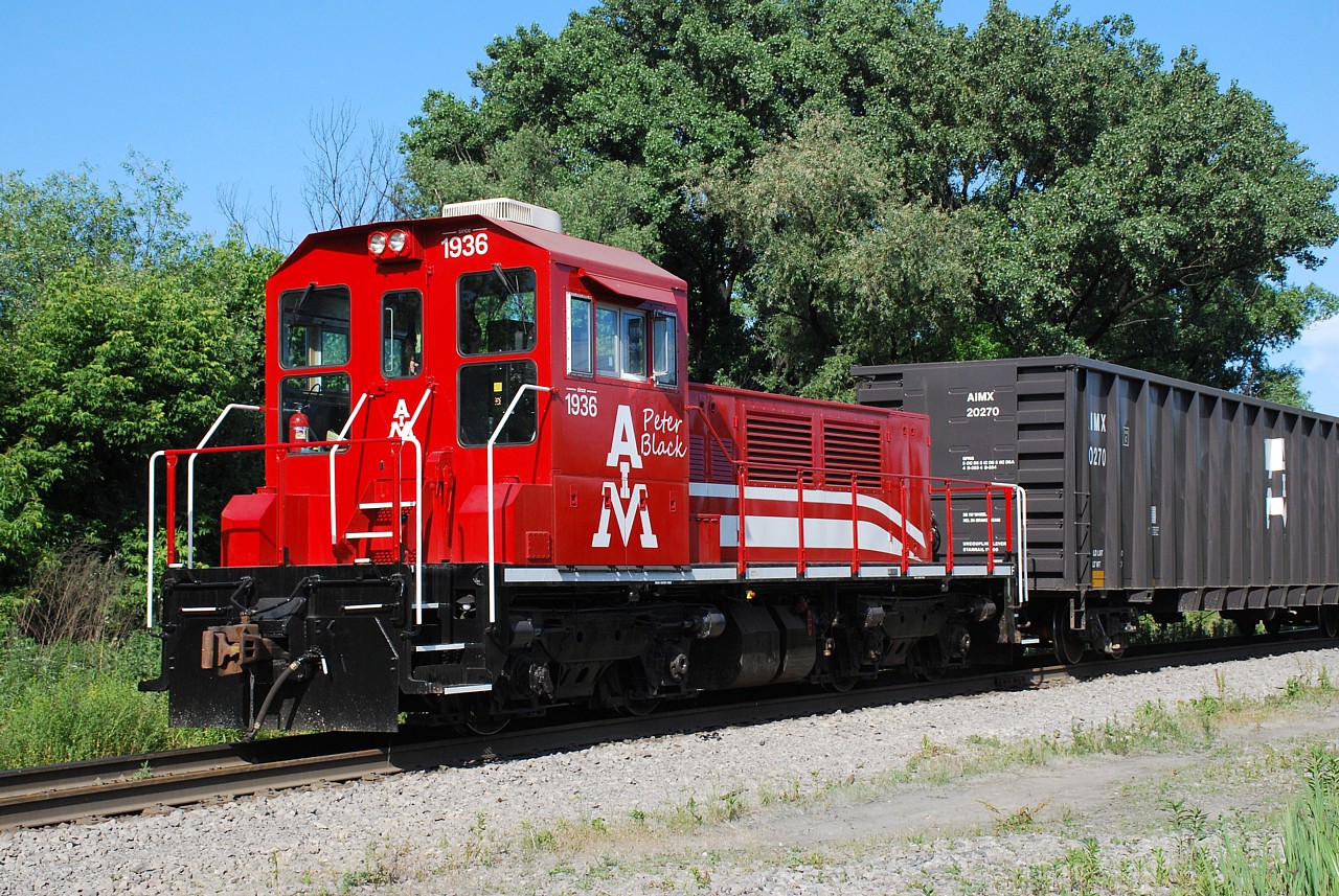 After a solid day of working from home I decided to go see if I could catch American Iron & Metal's TP90 in action.  Upon arrival at the north end of Parkdale Avenue there was what appeared to be a questionable individual outside his truck, however upon closer inspection I realised it was just Steve Host who apparently really misses his barber.  Any way, the Tractive Power Corp. unit wasn't moving so I just grabbed a few shots and left.  It's powered by a Cummins 513 hp Tier 4 engine, and sounded just like a truck when it briefly throttled up.  I'll have to go back another day when the sun holds out longer and they're actually moving cars around.