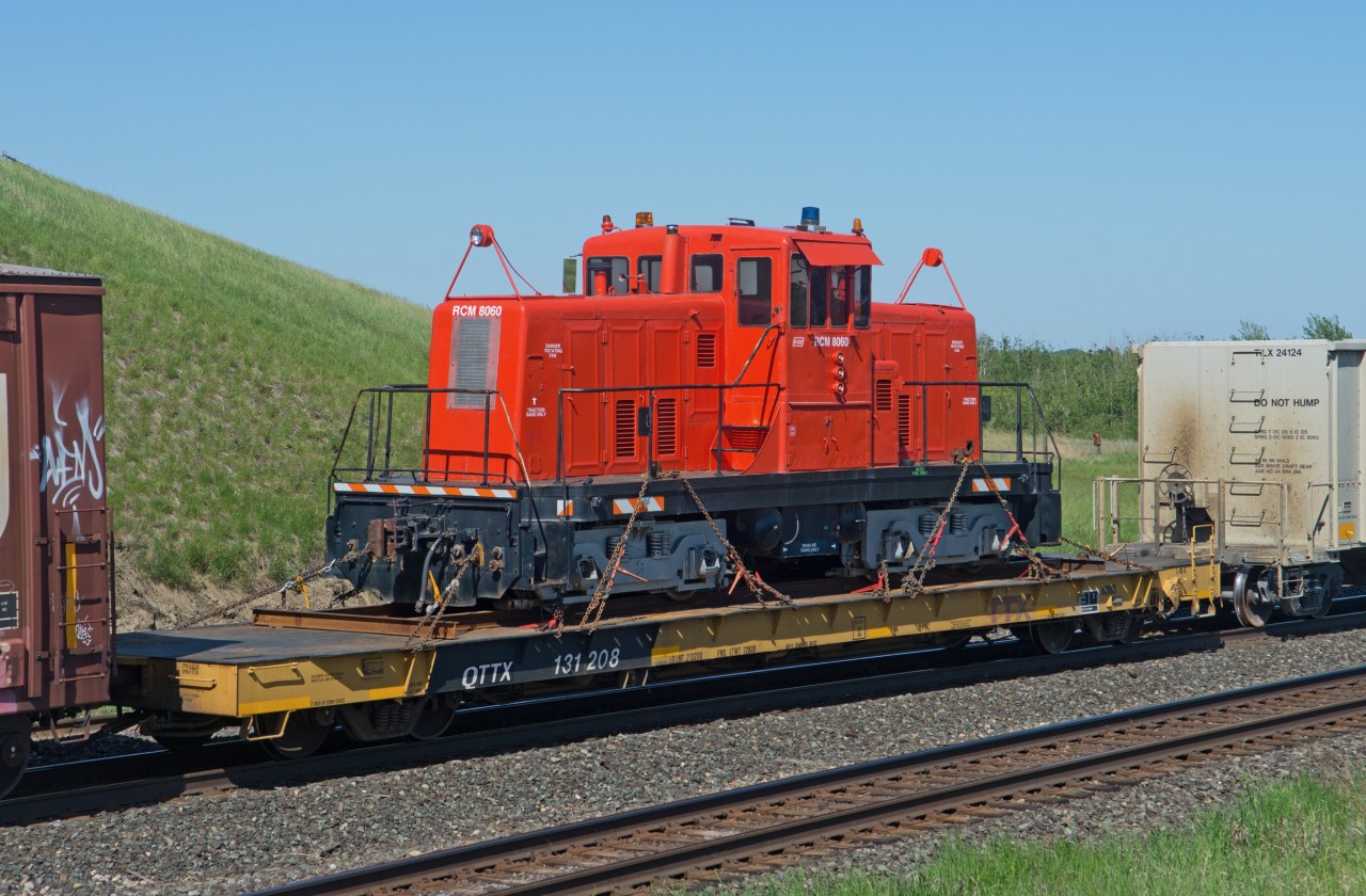 RCM 8060 is a GE 80tonner originally built for Algoma Steel. The unit is seen here on the tail end of a CN eastbound at Saskatoon Yard. The unit is reportedly billed to Greenville SC from On-Track Railway Operations in Daugh Alberta.