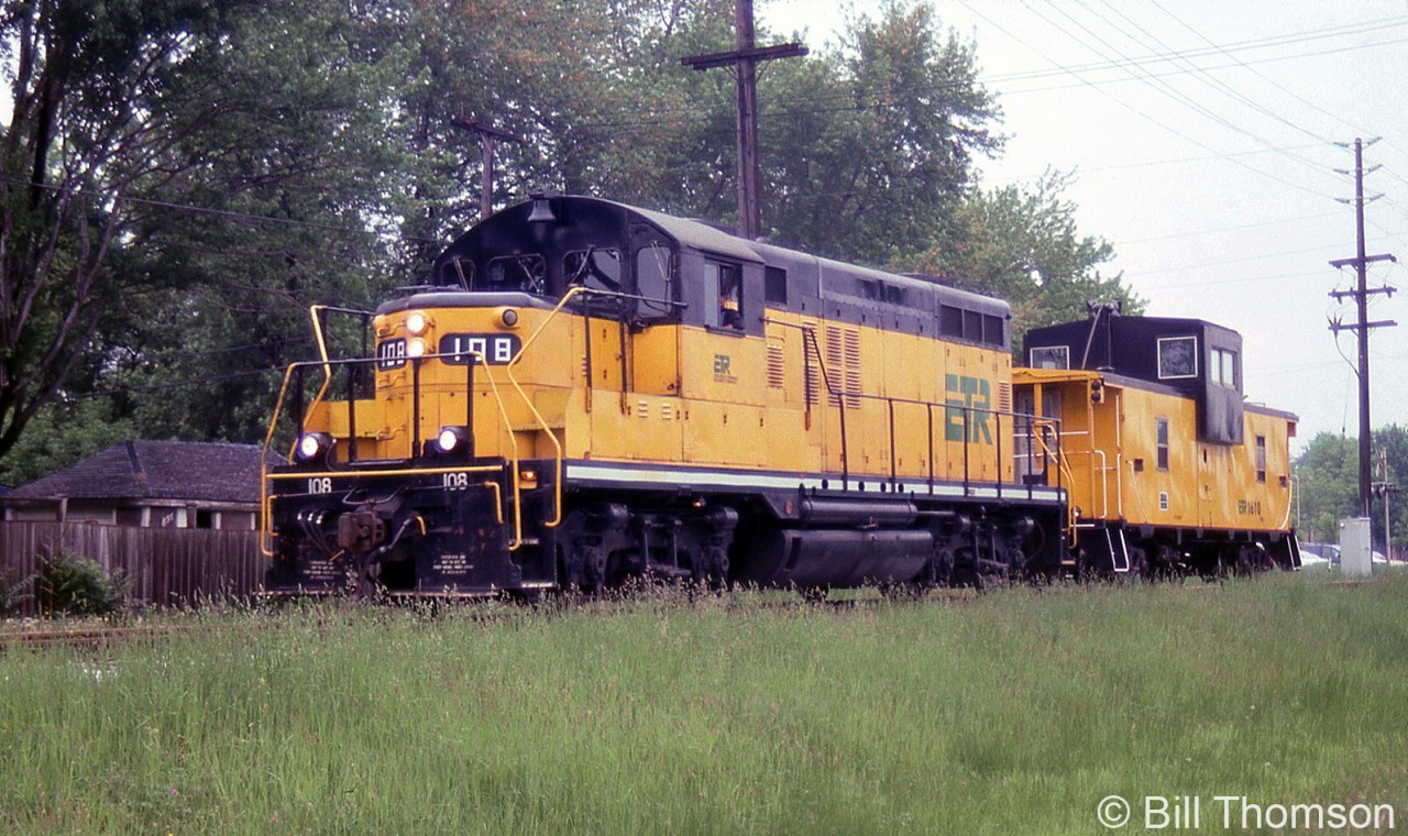 Essex Terminal Railway GP9 108 and caboose 1610 are seen on a move in Windsor in May of 2001. 108 was acquired secondhand from Quebec Cartier Mining in 1989 (former QCM unit 59). Two modifications made were the removal of its dynamic brakes, and the removal of its large front plow. The 1610 was former CP 434530, one of two ex-CP vans ETR acquired.