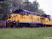 Essex Terminal Railway GP9 108 and caboose 1610 are seen on a move in Windsor in May of 2001. 108 was acquired secondhand from Quebec Cartier Mining in 1989 (former QCM unit 59). Two modifications made were the removal of its dynamic brakes, and the removal of its large front plow. The 1610 was former CP 434530, one of two ex-CP vans ETR acquired.