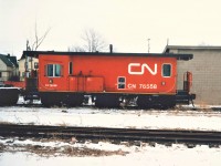 CN Burro Crane 50357 is separated from Transfer Van 76558 by a flat car.  The Van sits at the Welland St. Spur that connected off the Humberstone Sub just west of Bell St. and was the location of the then new CN General Cargo loading dock.  This type of dedicated rail bound MOW equipment would eventually be replaced by BRANDT equipment on most lines. 