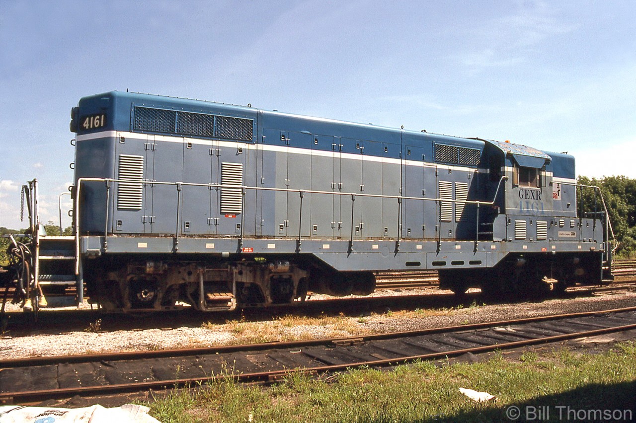 Goderich-Exeter slug 4161 is pictured at Goderich in August 2002. It started out life as a GP7 built for Kansas City Southern as 161, who later converted it into an unpowered road slug (renumbered KCS 4161).

Dallas, Garland and Northeastern RR acquired the unit and paired it up with GP35 66 (later GEXR 3834) as its slug mother. Both were sent to the GEXR in 1996, and after operating for years (in their old DGNO colours) both units were eventually sidelined out of service, and later scrapped. 4161 was scrapped in 2008, and 3834 in 2013.