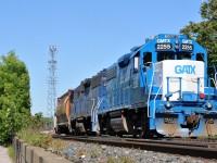 L58031 15 departs the yard with GMTX 2255, GMTX 2695, and 12 hoppers for Normerica out at Masseys