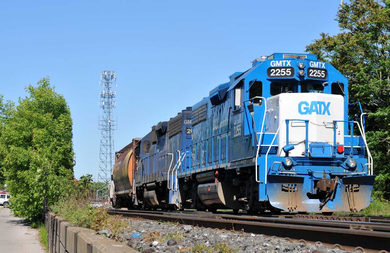 L58031 15 departs the yard with GMTX 2255, GMTX 2695, and 12 hoppers for Normerica out at Masseys