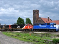 382 with CN 2871- CN 3267 makes a quick stop at Brantford to lift GMTX 2695 from the yard.

They pulled down to Masseys on the south track, before cutting off their train and making this move.