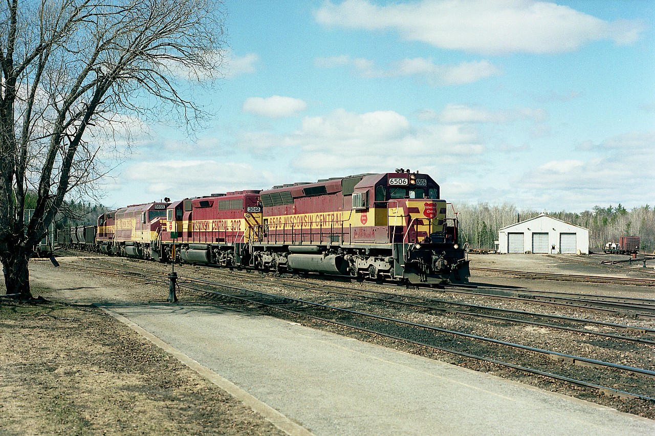 Beautiful clear morning up at Hawk Junction. Perfect conditions to catch WC 6506, 3012, 6655(SD45) and 6604 with a loaded train just coming off the Michipicoten Sub heading onto the SOO Sub and heading southward to the steel companies. This image was shot from the station platform.
The old AC enginehouse in the background still looks good, but one can see track has been partially lifted. These days, with CN in control since Oct 2001, I would imagine it is desolate around there..................