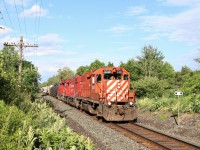 I've been waiting for this guy to finally lead T69 westward in bright sunshine and today it all came to be.
CP 3018 with CP 4427 and CP 2242 accelerate up the grade with 20 cars in tow on their way to a stop in Wolverton. The striped nose on the original GP38AC paint job makes for a nice change.