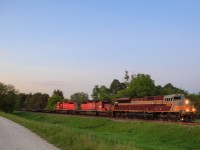 After setting off a handful of autoracks for Spence and lifting 1 car bound for Toronto, they meet a very late 119-07 at Spence. Lights fading and finally CWR-04 rolls into frame as it makes its way through the north end of Palgrave.