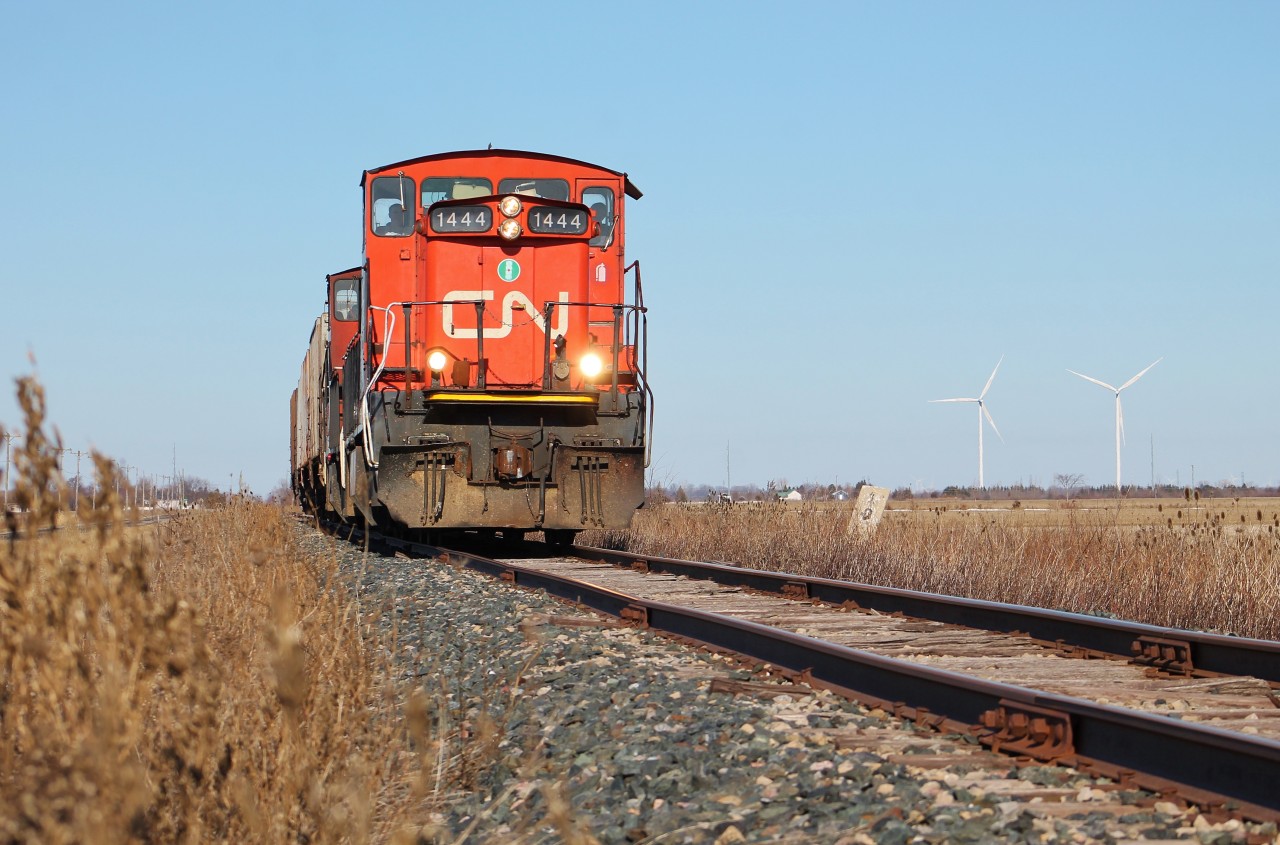 CN L514 passes an old cement milepost marker on the Sarnia Spur with a pair of GMD1s.