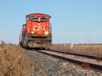 CN L514 passes an old cement milepost marker on the Sarnia Spur with a pair of GMD1s. 