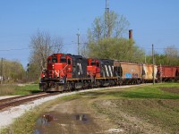 CN L514 rounds the connector between the Sarnia Spur and the Chatham Sub after shoving from the yard near the VIA station to Chatham East. The home signal for the now removed diamond between the Sarnia Spur (ex PM Sub 2) and the Chatham Sub can be seen to the left of the train. 