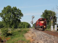 The Chatham Turn splits the intermediates east of town on a muggy spring afternoon. This relay mounted searchlight is likely one of the oldest signals still in use on this line. They have two gondolas that will be loaded with old ties in Chatham Yard and a single tank car for the ethanol plant in town. 