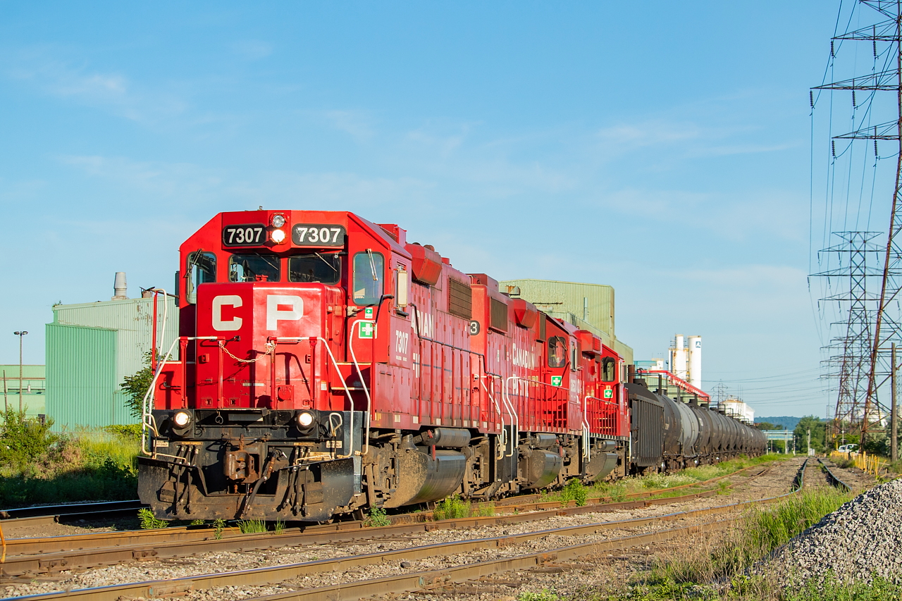 After a long night of cherry picking empty pellet hoppers at Aberdeen and helping 142 make the hill, TH21 returned to Kinnear only to find they had to spend the last couple of their maximum of 10 hours down the Belt. I can only imagine this was to their exhausted chagrin, however, selfishly it was to my delight. They dragged a cut of cars up to Adams Yard and set most of it off, before shoving back to the interchange and tacking a few cars onto what was already waiting for CN (pictured here). They'd then proceed back into Adams Yard and grab a drag to take back to Kinnear before heading home for a day's sleep.