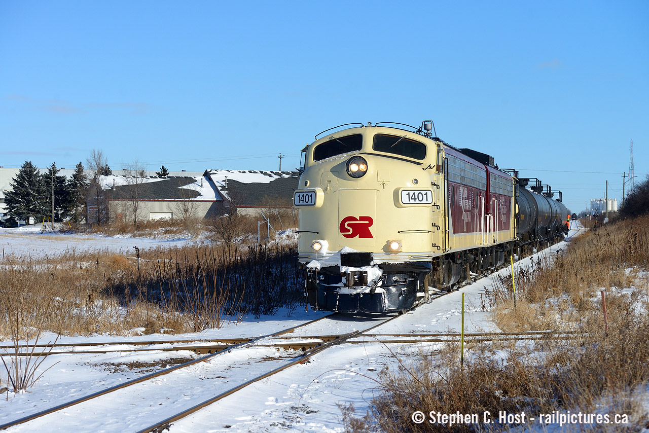 OSR's St. Thomas turn has just finished work in the former CPR formet yard in St. Thomas and just reversed over the CNR Cayuga subdivision diamond. The crew is seen approaching the Wabash transfer to fetch the rest of their train then head west into St. Thomas proper to work the yard there where they'll give me a few tries at the Tresle, for me , the first time with matching OSR painted F units. I wonder how many times Wabash F7's worked the Wabash Transfer in their 30 or so years of service in Canada. I love posting shots like this on blistering hot days, reminds of the cold we sometimes complain about. Looks good now doesn't it :)