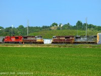 A quartet of SD70ACU's, each in a different paint scheme  meet in the soybean fields of Wolverton. This after a huge cloud shelf that seemed to be blocking the sun all morning finally cleared, thank goodness. Long live CP - what a time to be out, eh folks? I only have 3 business days left of my two week vacation (Forced) and have been making the most of it. More to come :)

