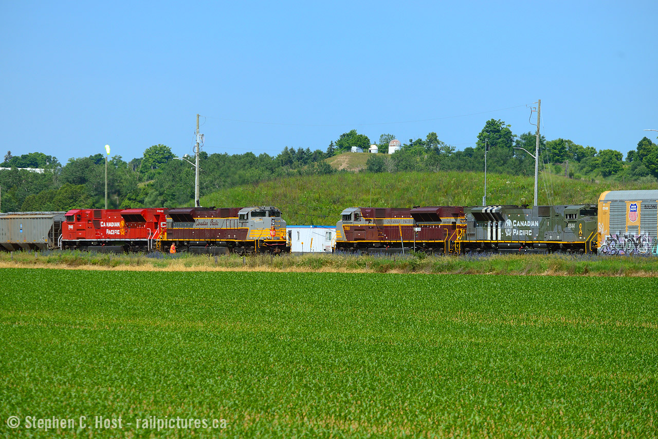 A quartet of SD70ACU's, each in a different paint scheme  meet in the soybean fields of Wolverton. This after a huge cloud shelf that seemed to be blocking the sun all morning finally cleared, thank goodness. Long live CP - what a time to be out, eh folks? I only have 3 business days left of my two week vacation (Forced) and have been making the most of it. More to come :)