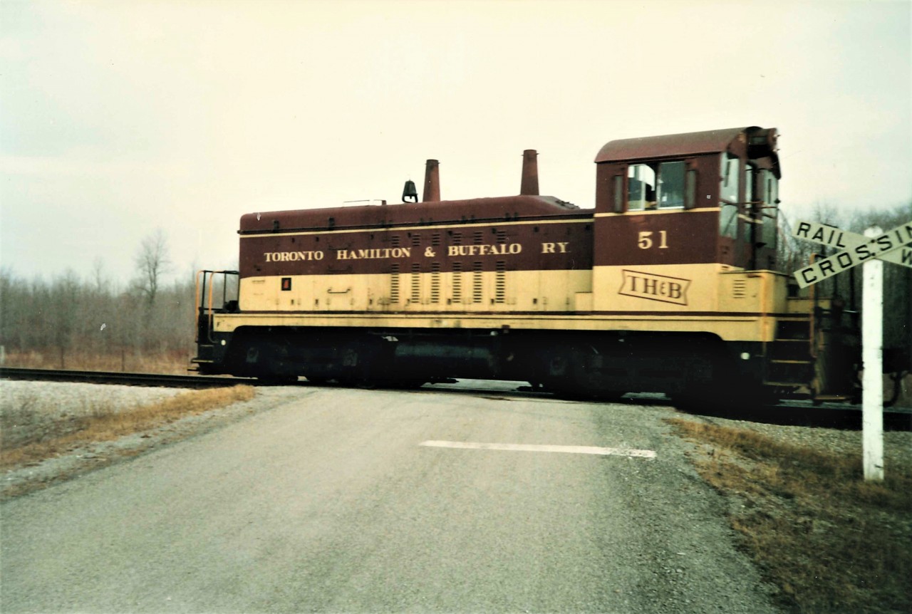 After being held at the CTC lights just south of Second Concession, #51 built up a lot of speed as she raced through the double track section of the Humberstone Sub.  By the time she hit Third Concession (where this shot was taken), the old EMD product was in excess of 50 mph with her three CP Green Boxcars and Van #83 in tow.