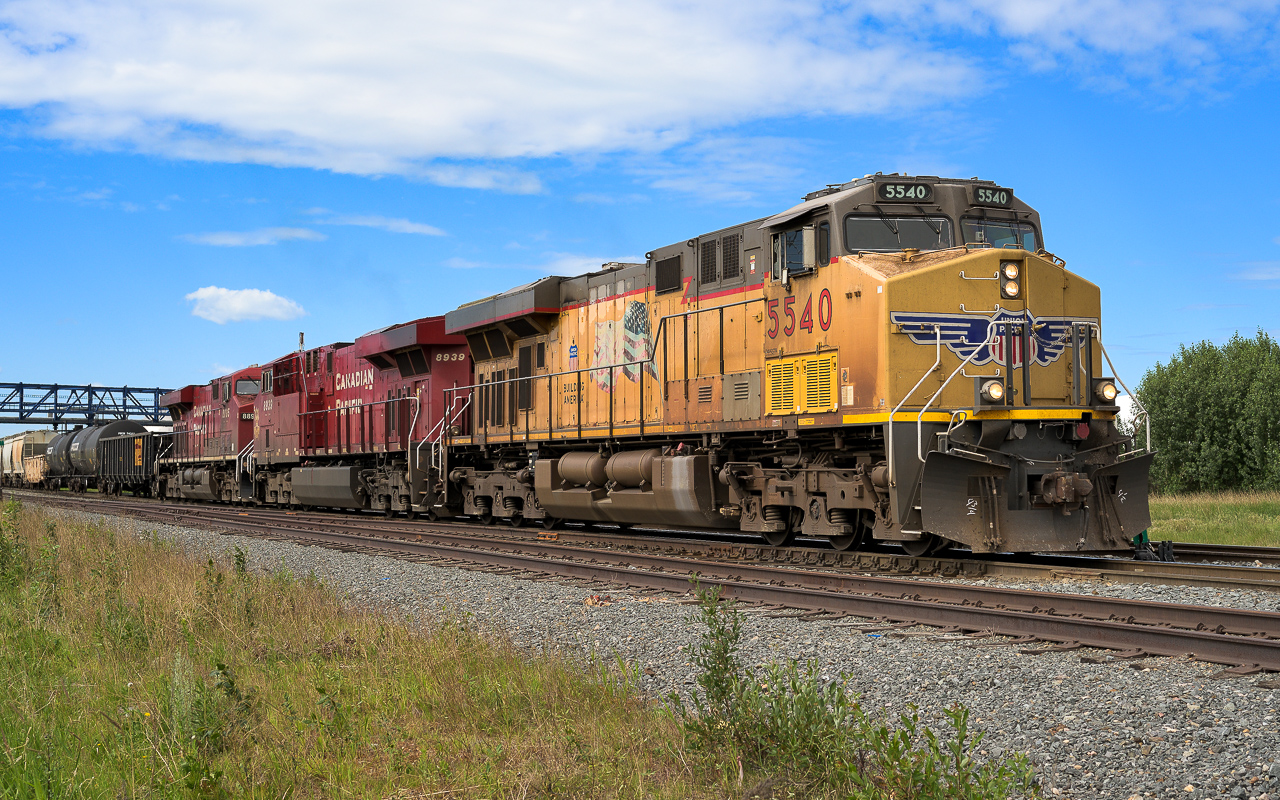 On the way to tend the many industries located around Scotford. These trains are typically pretty long and this one is of considerable size. CP does a good business northeast of Edmonton. The work days are long and I would imagine the crews enjoy the bonus of overtime hours and the extra pay. The occurrence of foreign units has become somewhat rare in 2020. What was common in 2018 is not so this summer.