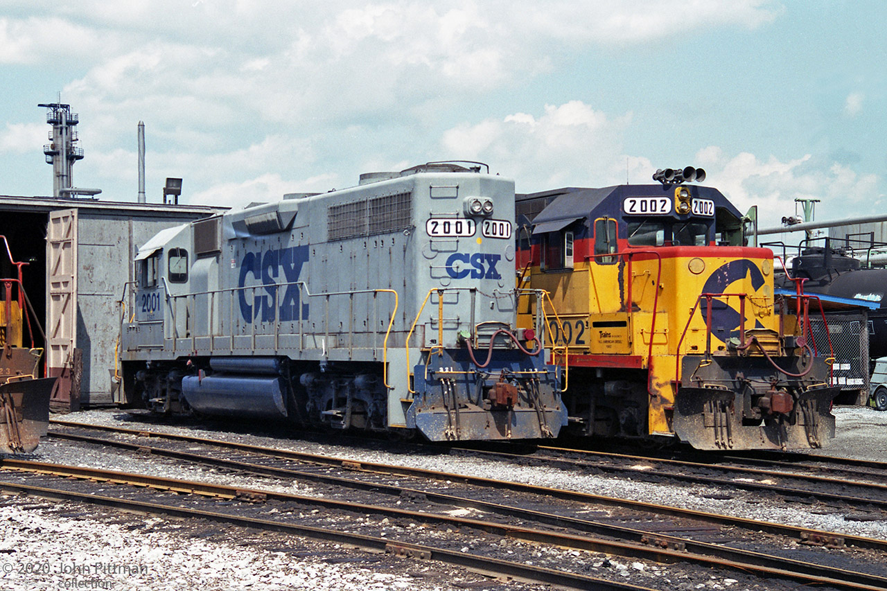 Tail and head end of two CSX EMD GP38 units at the CSX locomotive facility in Sarnia.
Both originally built for the Baltimore & Ohio Railroad, as BO 3801 and BO 3802.
Numbered by B&O for their EMD model, their CSX number series matches their 2000 horsepower.
CSXT 2002 in Chessie System colours has a unique title:  Trains Magazine's "All American Diesel" 1982
It wears this identification on the box ahead of the cab-side unit number.
BO 3801 was in the B&O blue scheme in 1985, so it likely wore those colours into the CSXT merger.