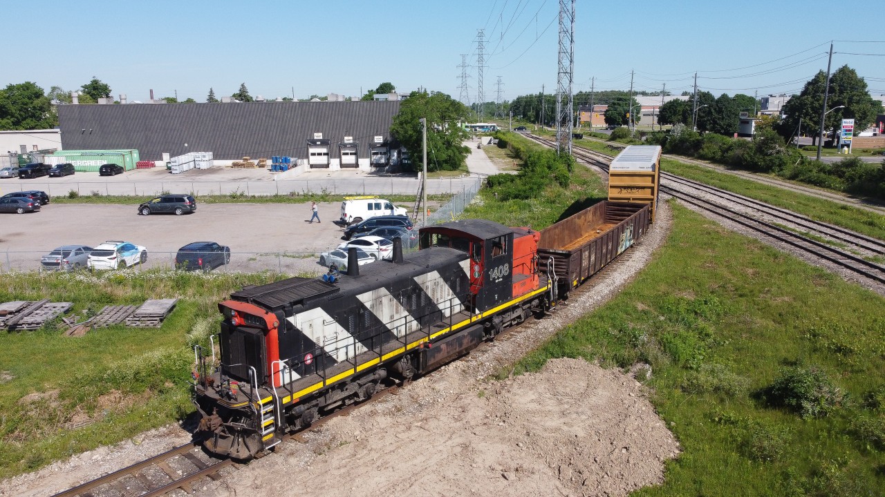 CN 1408 sits on a leg of a wye in Guelph while the crew goes off to work other industries with the GMTX 2163.