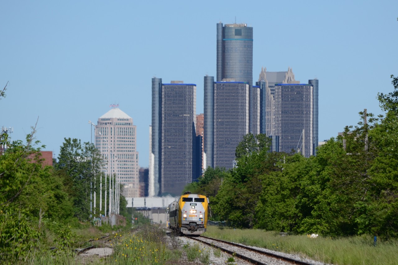 VIA train 72 just left Windsor Station, and is rocking back and forth on the mainline, with the GM Renaissance Center in Detroit Michigan in the background.
