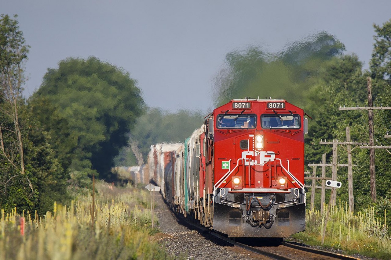 Just after sunrise, and looking mighty clean, 234 starts to pick up speed on the roller coaster east of Galt.