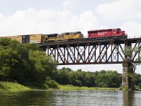 244 with UP 8711 trailing, cross the Grand River with a healthy string of empty autoracks behind 5 other cars. While I wouldn't want to see them 100% of the time as in days of old, there is something wonderful and about a rebuilt SD40-2 leading in 2020