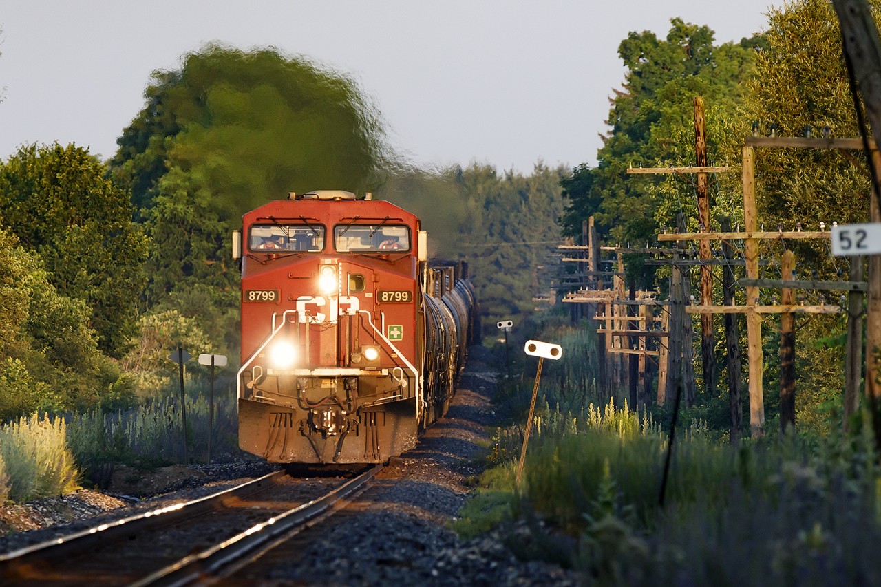 Sounding a little ill, 8799 and DPU 8150 shatter the dawn with ethanol loads for Albany.